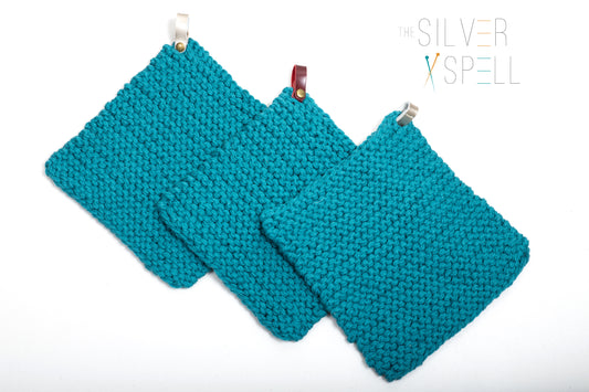 three teal hot pads shown next to each other