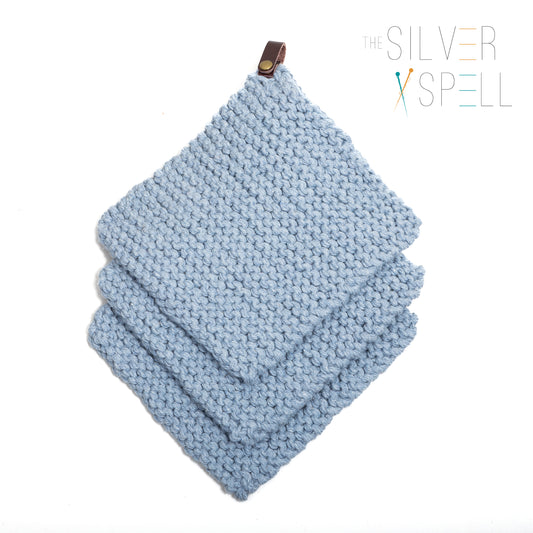 Three towels in blue stocked on top of each other